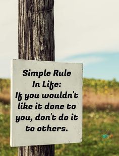 a sign on a telephone pole that says, simple rules in life if you wouldn't like it don't do it to you, don't do it to others