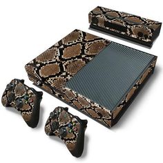 an animal print skin for the nintendo wii console and two game controllers, all in different patterns