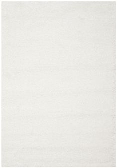 a white area rug with no pattern on it