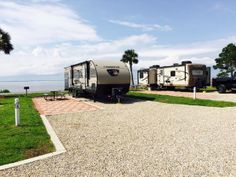 an rv park with several recreational vehicles parked on gravel