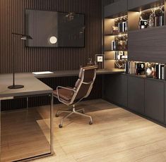 an office with a desk, chair and bookcases in front of the wall