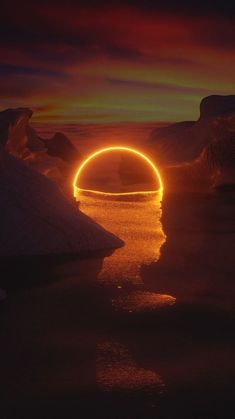 the sun is setting over some icebergs with an orange ring in the middle