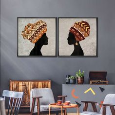 two framed art pieces on the wall in a living room