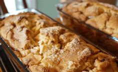 two trays filled with baked goods sitting on top of a table