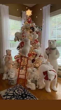 a christmas tree decorated with white teddy bears