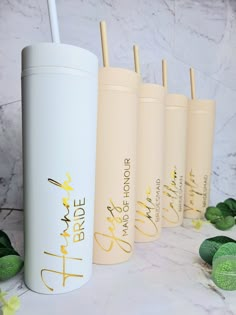 the bride tumblers are lined up next to each other with straws in them