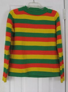 Late 1970s Vintage Hot Dog - The Jacobs Corporation of Boulder Colorado  Stripe Sweater Rasta Colors Green Orange Yellow Striped Acrylic Sweater.  Teen Boys Size  XL or Mens Size Small to Medium or Womens Size Medium. The sweater has a crew neckline and long sleeves with ribbing detail at the neckline. It is made of acrylic yarn in an allover striped pattern of wide bright green, yellow, and orange stripes. The sweater was made in Taiwan of 100% acrylic, and is machine washable. A great sweater Rasta Colors, Acrylic Sweater, Boulder Colorado, Colors Green, Yellow Stripes, Crochet Sweater, Red Sweaters, Bright Green, Green Orange