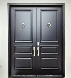 two black double doors with handles on each side