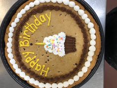 a birthday cake with frosting and sprinkles on it that says happy birthday