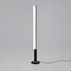 a black lamp with a white light on it