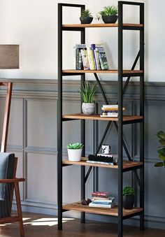 a bookshelf with plants on it in a living room