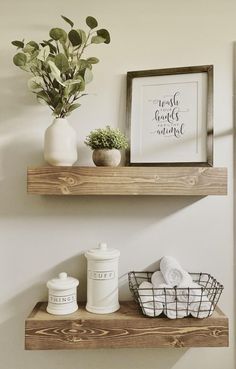 two shelves with towels and plants on them