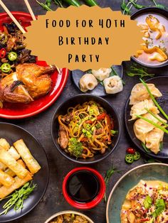 a table topped with lots of different plates and bowls filled with food next to chopsticks