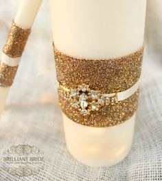 a close up of a cup on a table with some gold glitter tape around it