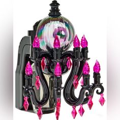 a black and pink chandelier with lots of lights