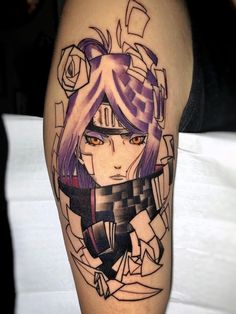 a woman's leg with an anime character tattoo on the side of her thigh