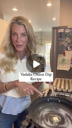 a woman pointing to a wok on top of a stove with the words vadala onion dip recipe in front of her