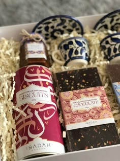 an assortment of chocolates and confection items in a box with decorative ornaments