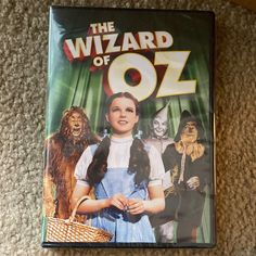 the wizard of oz dvd is laying on the floor