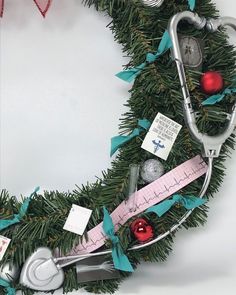 a christmas wreath decorated with medical supplies and ornaments, including a stethoscope