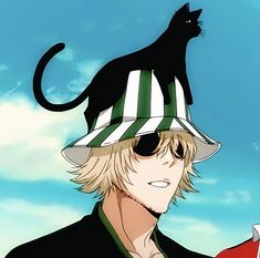 a black cat sitting on top of a man's head wearing a striped hat