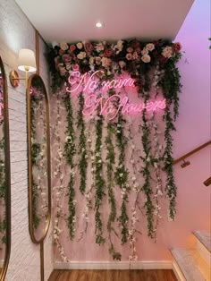 there is a pink wall with flowers on it