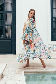 The flutter sleeves give it a dreamy vibe. This is a wardrobe must-have when worn over a lovely slip, jeans, and a tank! Flowy Summer Dress With Cape Sleeves, Summer Dresses With Cape Sleeves And Floral Print, Flowy Summer Dresses With Cape Sleeves, Summer Feminine Floral Print Kimono, Feminine Floral Print Summer Kimono, Bohemian Ruffle Sleeve Dress For Vacation, Bohemian Dress With Ruffle Sleeves For Vacation, Flowy Bohemian Kimono For Brunch, Bohemian Summer Dresses With Butterfly Sleeves