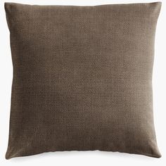 a brown pillow on a white background