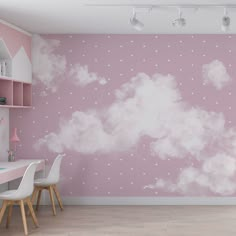 a pink and white room with clouds painted on the wall