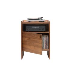 the record player is sitting on top of the cabinet