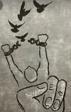 a drawing of a hand with birds flying over it