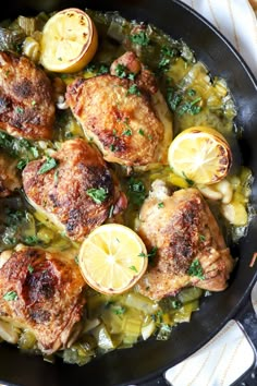 chicken with potatoes and lemons in a skillet