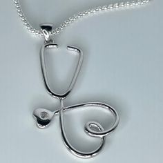 *  Sterling Silver Large Heart Stethoscope Pendant Necklace, Heart Promise Necklace, Silver Love Necklace, Nurse Heart Jewelry, Stethoscope Necklace, Frontline Worker Jewelry, Silver CZ Pendant, Nurse Necklace, Doctor Necklace, Hospital Staff. 925 Stamped *  Perfect gift idea for any occasion: birthday, anniversary, engagement, graduation, bridesmaid, Mother's Day, Valentine's Day, Christmas, Graduation Gift, promise. *  Stethoscopes symbolize a nurse's commitment to care for his patients' healt Cf Lung Necklace, Greys Anatomy Necklace, Stethoscope Pendant, Mother Day Jewelry, Doctor Necklace, Nurse Necklace, Doctor Jewelry, Necklace Gift Ideas, Heart Stethoscope