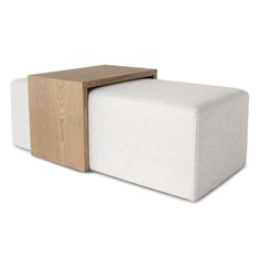 a white couch with a wooden block on the top and bottom side, sitting in front of a white background