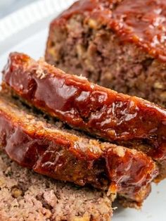 sliced meatloaf on a plate with ketchup