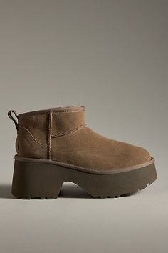 Sheepskin upper, insole Sugarcane EVA sole Pull-on styling Imported | Classic Ultra Mini New Heights Boots by UGG in Brown, Women's, Size: 9, EVA at Anthropologie Camel Chunky Boots, Best Amazon Booties, Ugg Classic Mini Brown, Ugg Classic Mini Ii Brown, Ugg Ultra Mini Shine, Ulta Mini Ugg Boots, Short Tan Ugg Boots, Super Mini Ugg, Ugg Mini Or Short