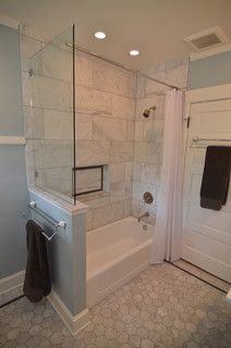 a bathroom with a shower, toilet and bathtub