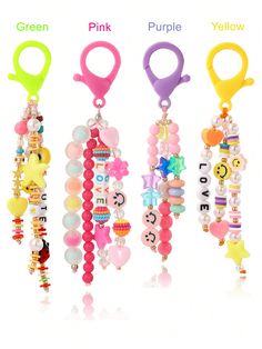 three key chains with charms attached to them, one is pink, the other is yellow