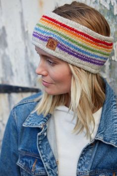 Rainbow stripes with an OOAK twist. This headband will brighten up any winter day!This stunning women's hand knitted wool headband and ear warmer is handmade in Nepal using fair trade practices, and decorated with eye-catching patterns. An accessory that's sure to keep you cozy and in fashion this season!100%WoolFleece linedFair Trade and Handmade in Nepal Machine wool wash max 30 degrees or cool handwash. Short spin. Dry flat. Do not tumble dry. Knitted Rainbow, Hand Knit Headband, Rainbow Headband, Festival Headband, Handmade Fair, Knitted Headband, Knit Headband, Matching Sweaters, Wool Wash