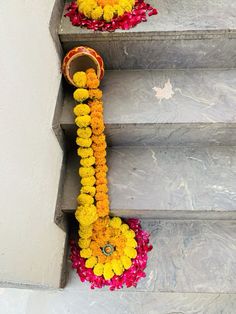 the flowers are arranged on the steps to decorate them for someone's special occasion