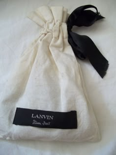 a white bag with a black label on it