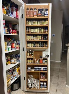 an open pantry filled with lots of food and condiments on the shelves next to each other