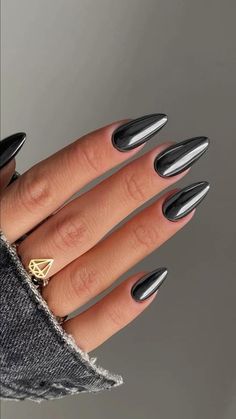 Combining matte nails with chrome accents is a stunning way to play with textures and create a striking look. The smooth, muted effect of matte polish on most nails provides a chic, understated base. By adding chrome to a few accent nails, you get an eye-catching contrast that elevates the whole design. This mix of matte and chrome works well with various colors, from soft pastels to bold, dark shades, and it’s ideal for those who want a sophisticated yet trendy look. Black Chrome Acrylic Nails, Black Chrome Nails Almond, Crome Nails Designs, Nail Designs Edgy, Chrome Nails Dark, Dark Green Chrome Nails, Black Nails With Chrome, Black Chrome Nails Designs, Black Chrome Nail