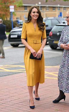 the duke and duchess of cambridge are walking together