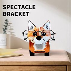 a paper cut out of a fox with glasses on it's head and the words spectacle bracket above it