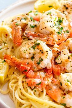 pasta with shrimp and lemon on a plate