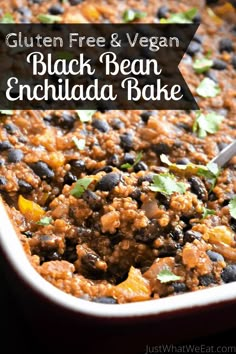 black bean enchilada bake in a white dish with a spoon on the side