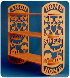 a wooden shelf with the words home sweet home on it