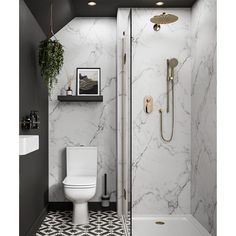 a white toilet sitting in a bathroom next to a walk in shower with a black and white tiled floor