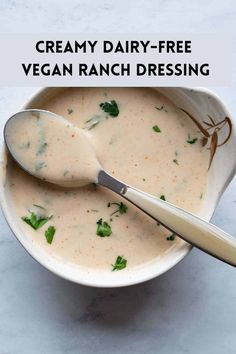 creamy dairy - free vegan ranch dressing in a white bowl with a ladle